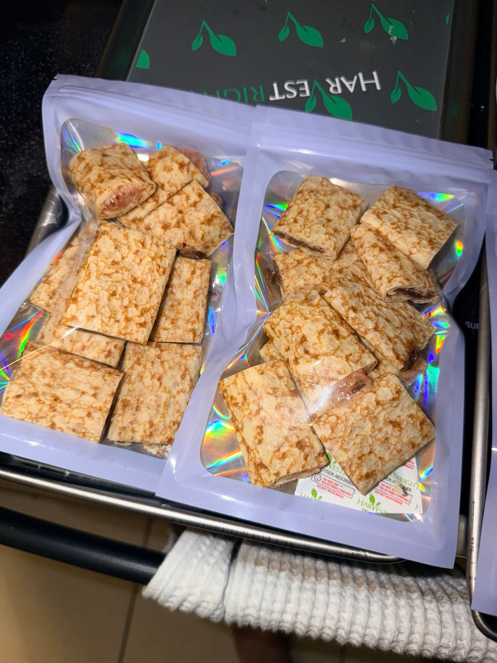 Two pouches of crispy freeze-dried strawberry-filled and Nutella-filled crepe bites