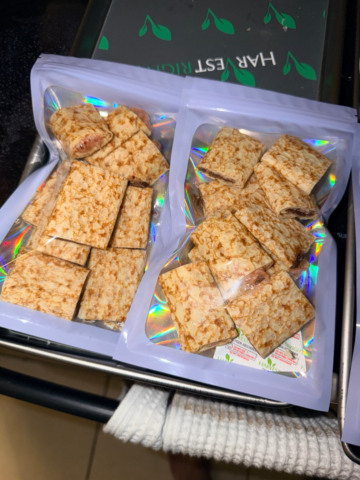 Two pouches of crispy freeze-dried strawberry-filled and Nutella-filled crepe bites