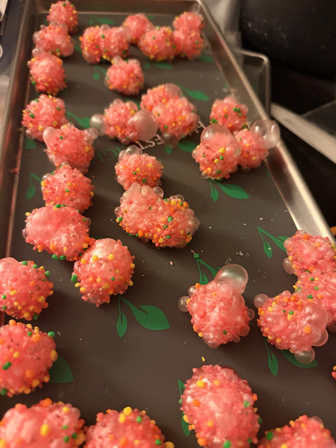 Pink freeze-dried Nerds gummy clusters expanded into crunchy candy bites
