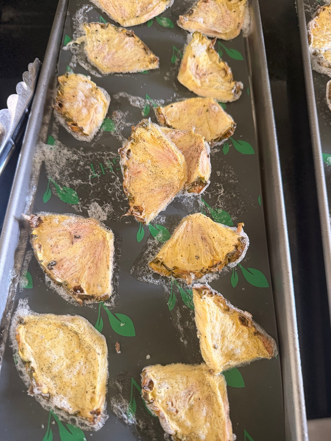 Freeze-dried pineapple wedges on a tray