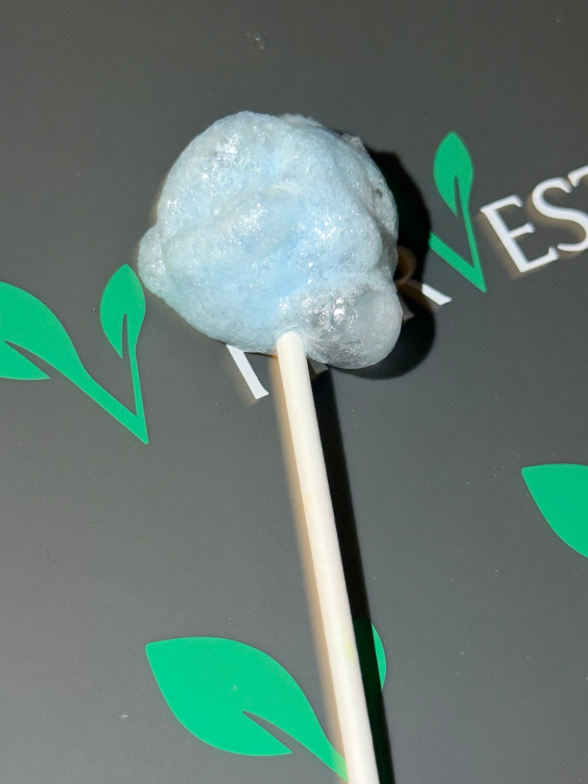 Blue freeze-dried lollipop with an airy crunchy texture